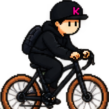 Rider on a loaded bike, packed for a long trip.